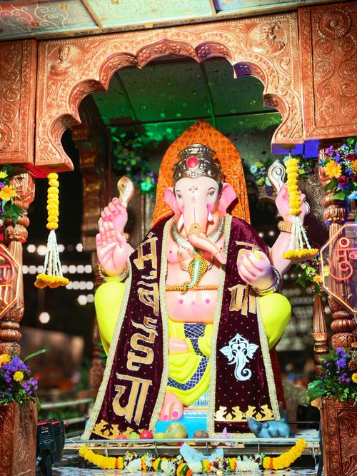Free Vibrant Ganesha idol during Ganesh Chaturthi in Mumbai, showcasing rich cultural festivities. Stock Photo