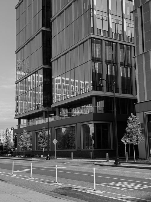 Free Black and white photo of a modern glass building in an urban setting, Boston, USA. Stock Photo