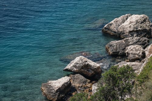 Free Beautiful rocky coastline in Split with clear blue Adriatic Sea. Perfect summer vibe. Stock Photo