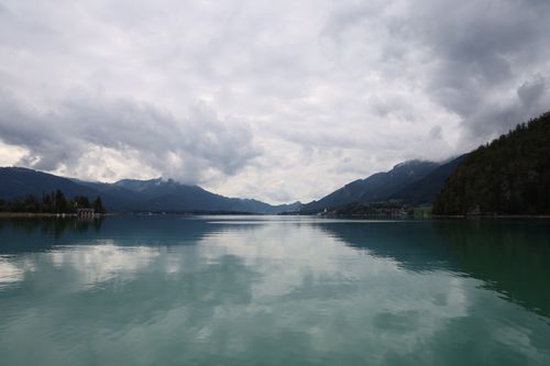 Free Peaceful lake with mountains under cloudy skies in Austria, ideal for tranquil scenery. Stock Photo