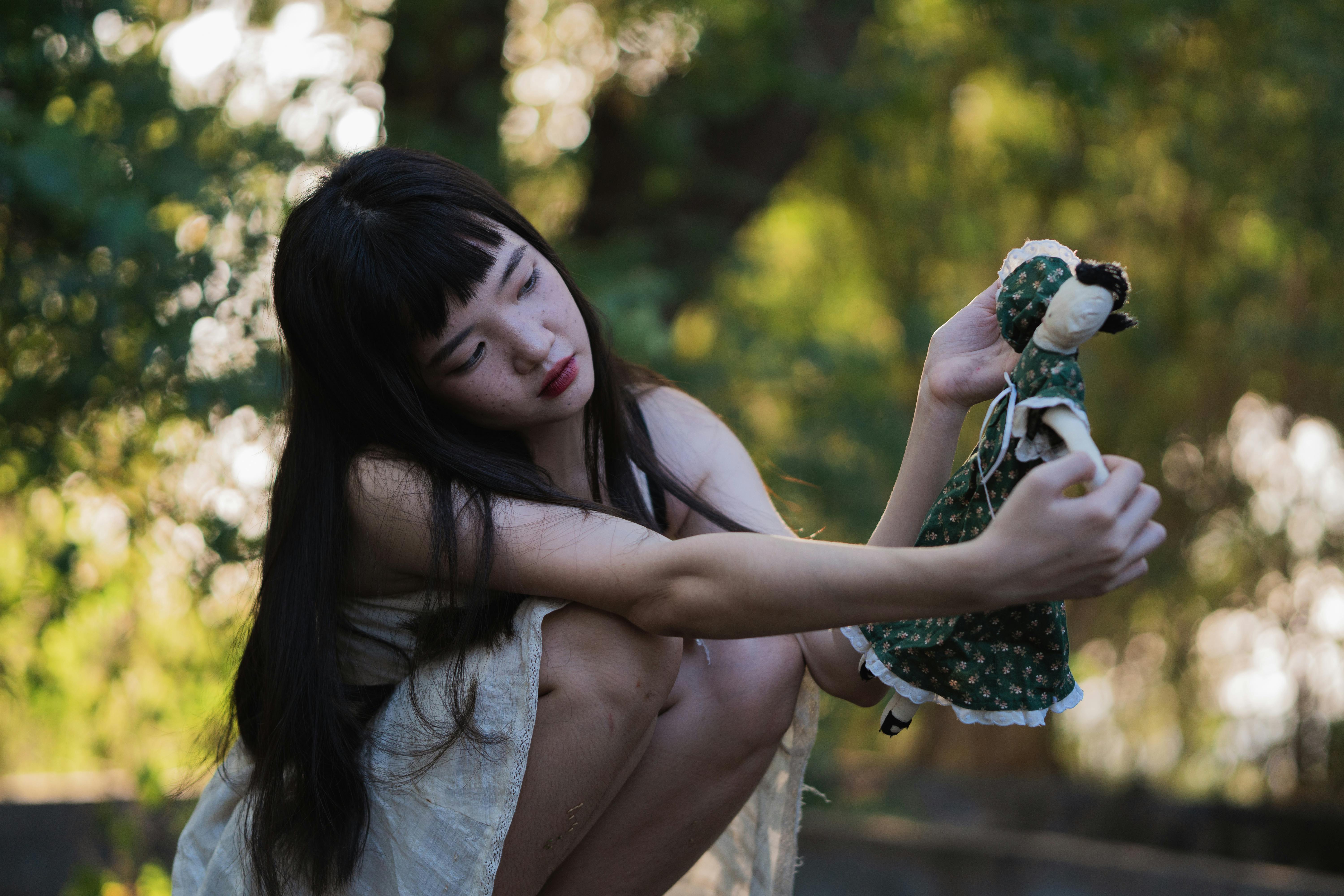 girl holding a doll