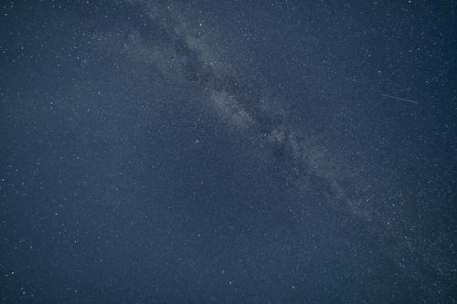 Free A breathtaking photograph capturing the Milky Way galaxy on a clear night sky. Stock Photo