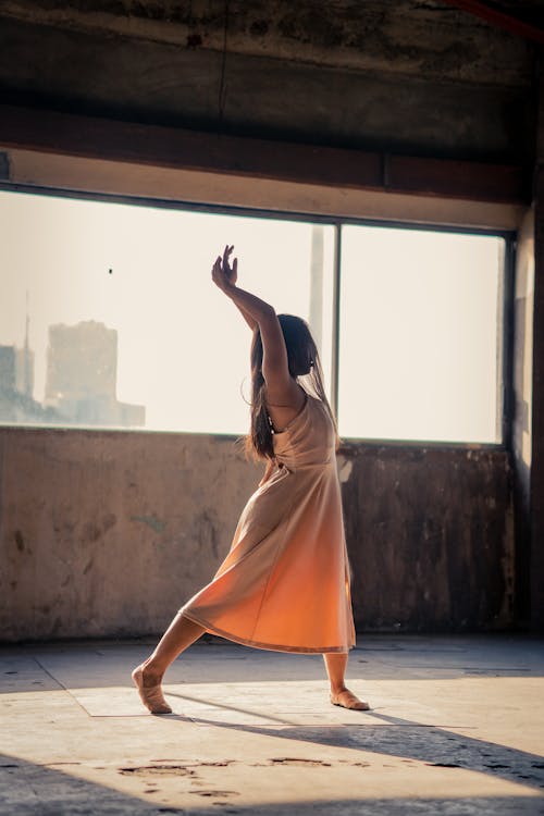 Free Woman In A Dress Dancing Stock Photo