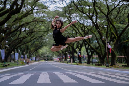 Woman Doing Ballet In The Middle Of The Road