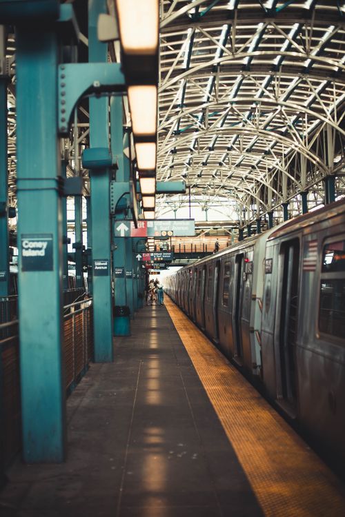 Free A New York City subway train at a vibrant station with intricate architecture. Stock Photo