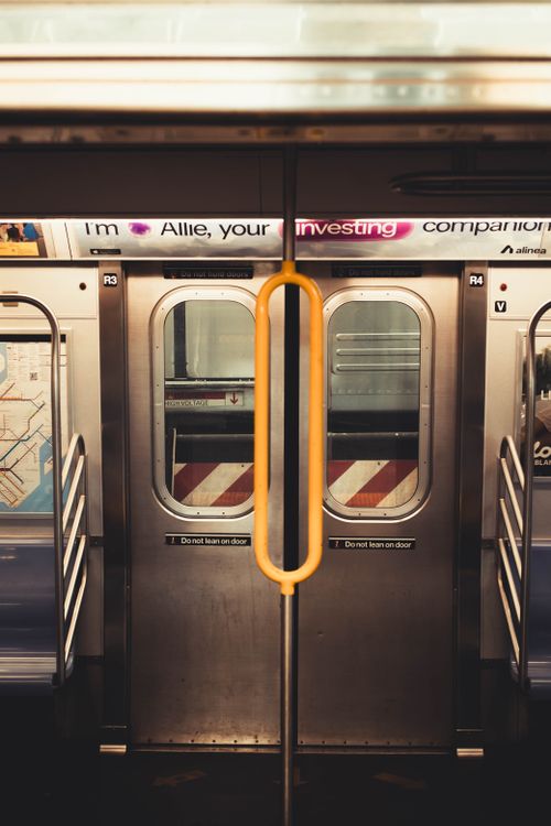 Free A detailed view of the interior of a New York City subway car with closed doors. Stock Photo