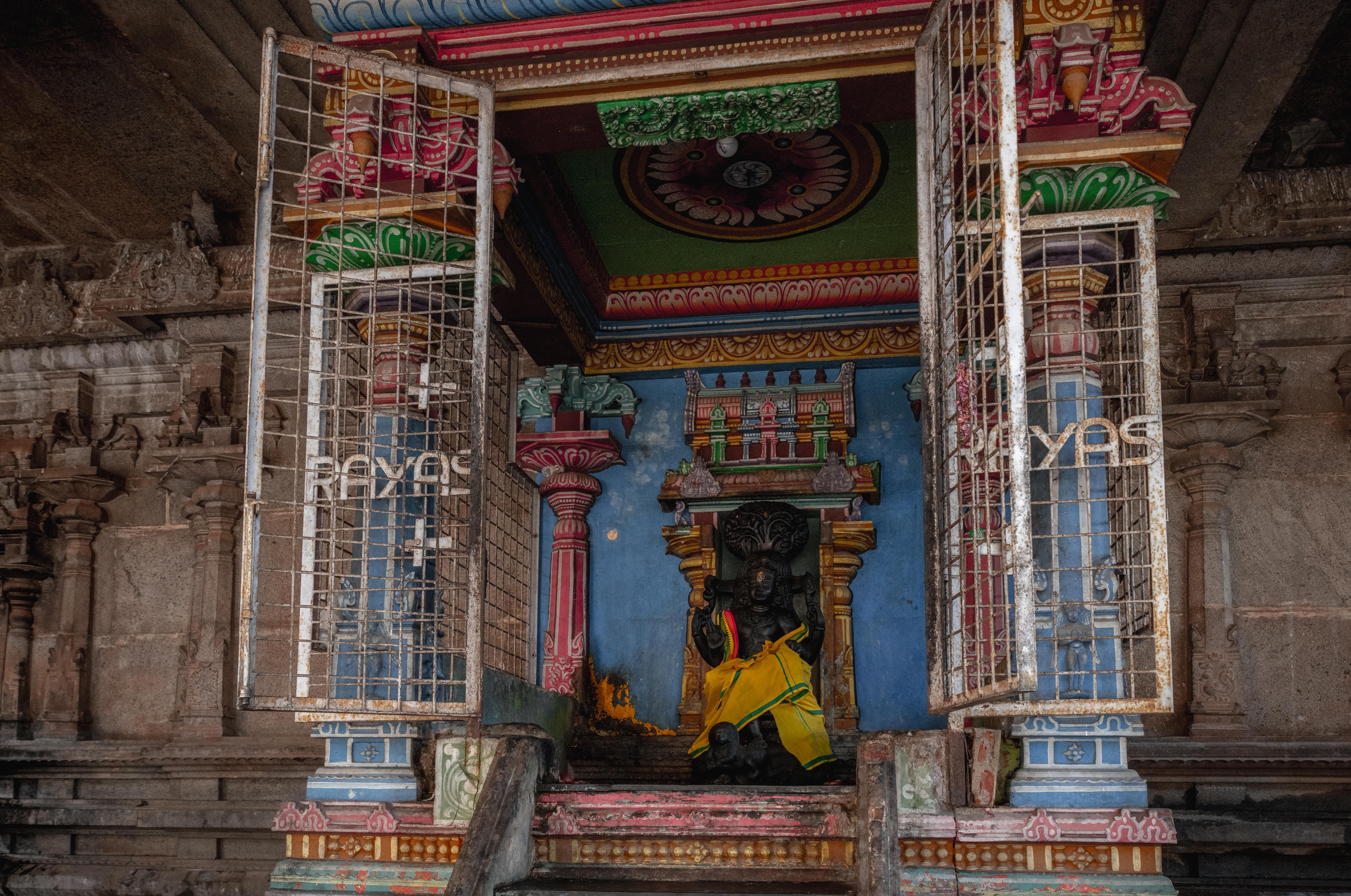 Colorful temple shrine interior in Kumbakonam, Tamil Nadu, showcasing South Indian architecture.
