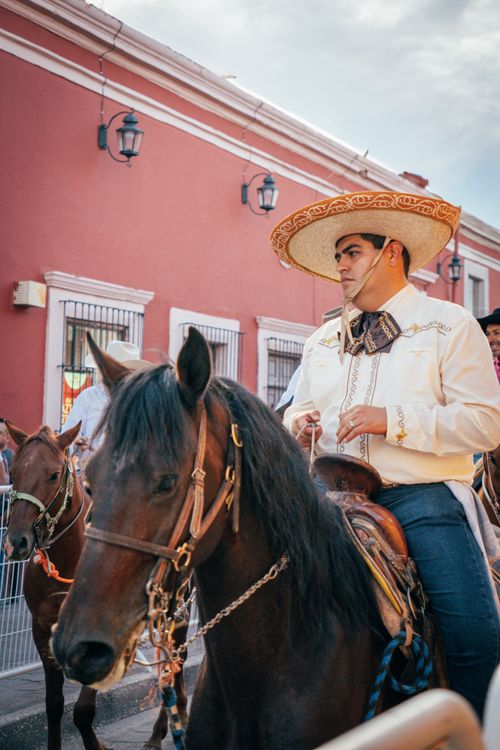 Free A traditional charro parades on horseback in Dolores Hidalgo, celebrating Mexican culture. Stock Photo