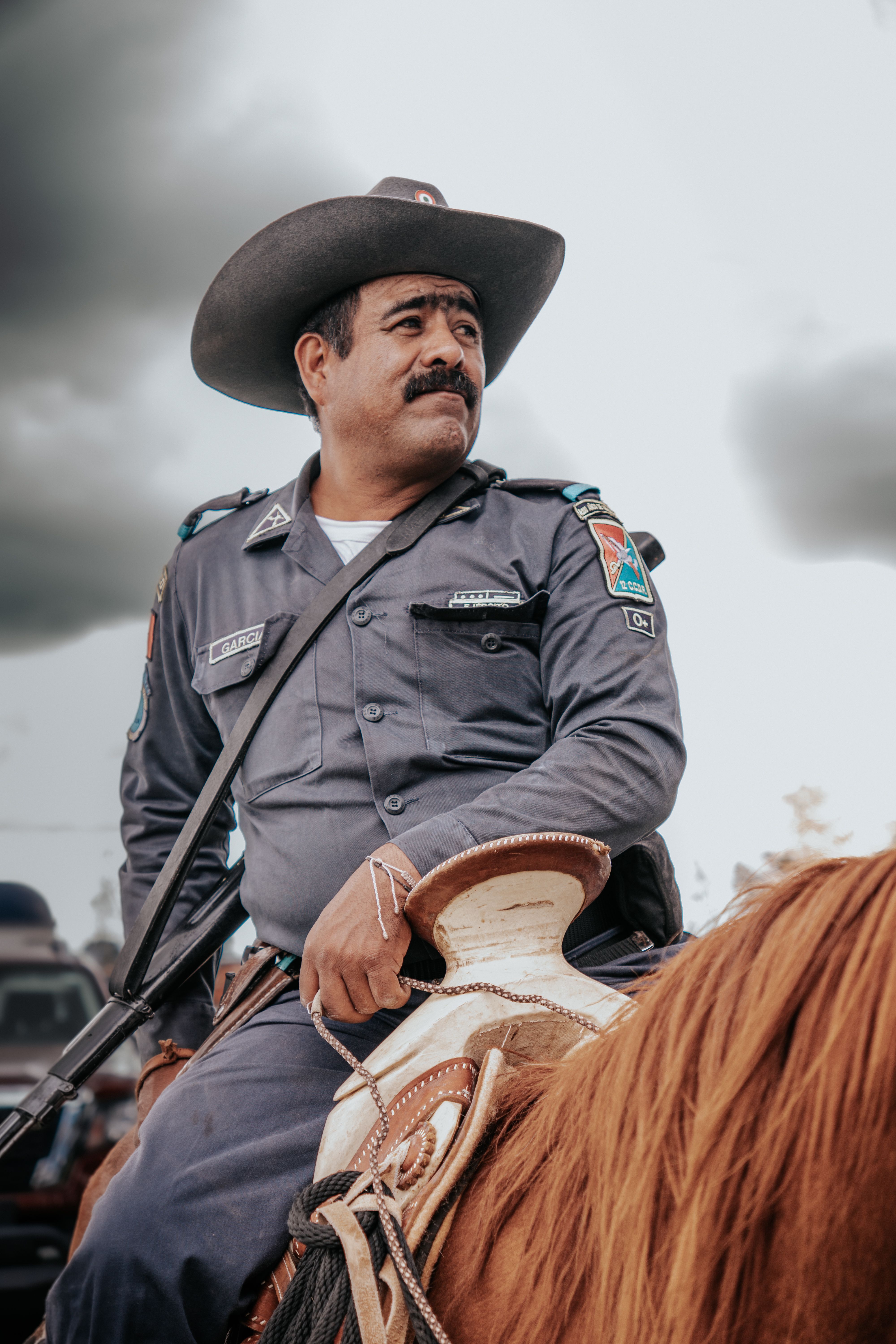 Charro dressed in uniform riding a horse during a festive parade in Dolores Hidalgo, Guanajuato, Mexico.