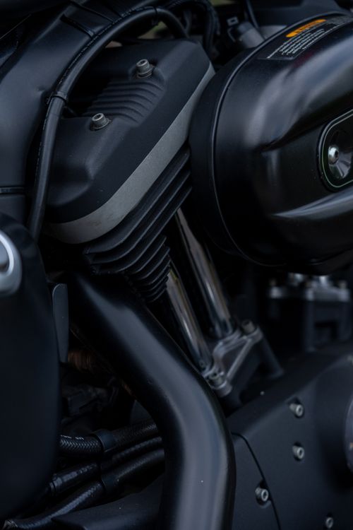 Free Detailed view of a motorcycle engine showcasing its complex parts and design. Stock Photo