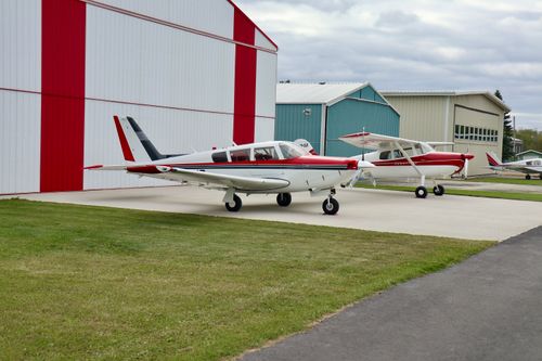 Free Private aircraft parked at an airstrip in Sherwood Park, Alberta, Canada on a cloudy day. Stock Photo