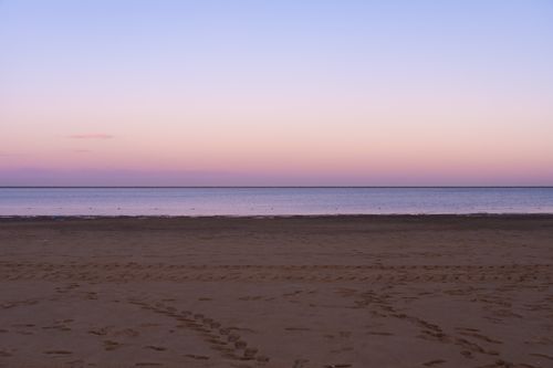 Free Calm evening beach scene with pastel skies in Tianjin, China. Perfect tranquil coastal setting. Stock Photo