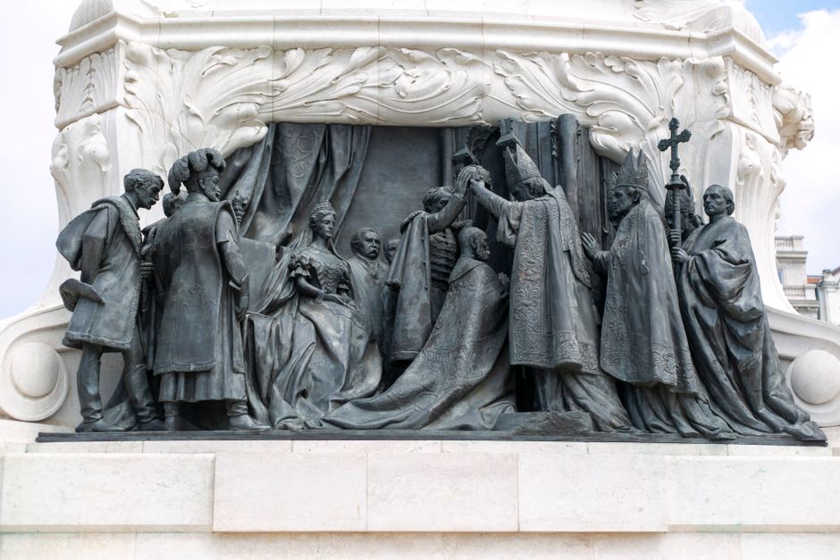 Sculptural detail of a historical monument in Budapest showcasing an ornate ceremonial scene.