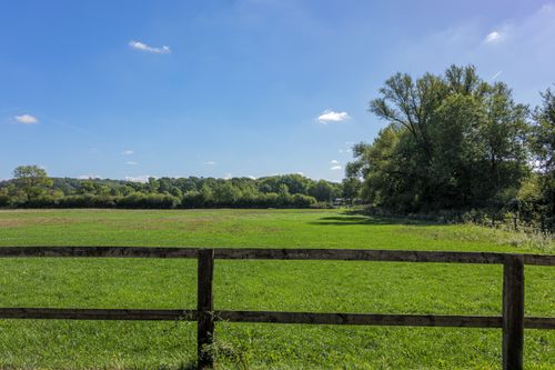 Free Peaceful pastoral landscape in Coesfeld, Germany with green fields and blue sky. Stock Photo