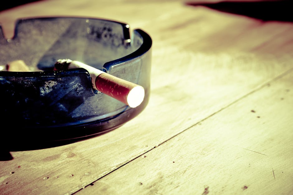 Lit Cigarette in Ashtray