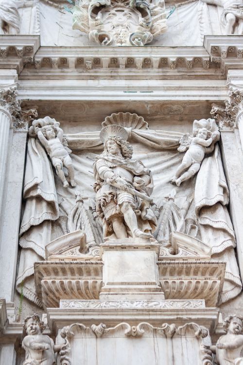 Free Beautiful Baroque architectural sculpture depicting religious figures in Venice, Italy. Stock Photo