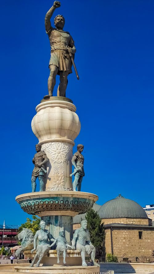 Free Majestic statue of Alexander the Great in Skopje under clear blue skies, showcasing classical architecture. Stock Photo