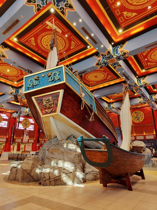 Free Intricately designed traditional sailboat displayed in Dubai Mall's vibrant interior setting. Stock Photo