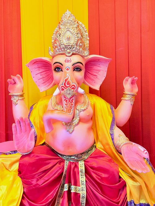 Free Brightly colored Ganesha idol with intricate details celebrated during Ganesh Chaturthi in Kolkata, India. Stock Photo
