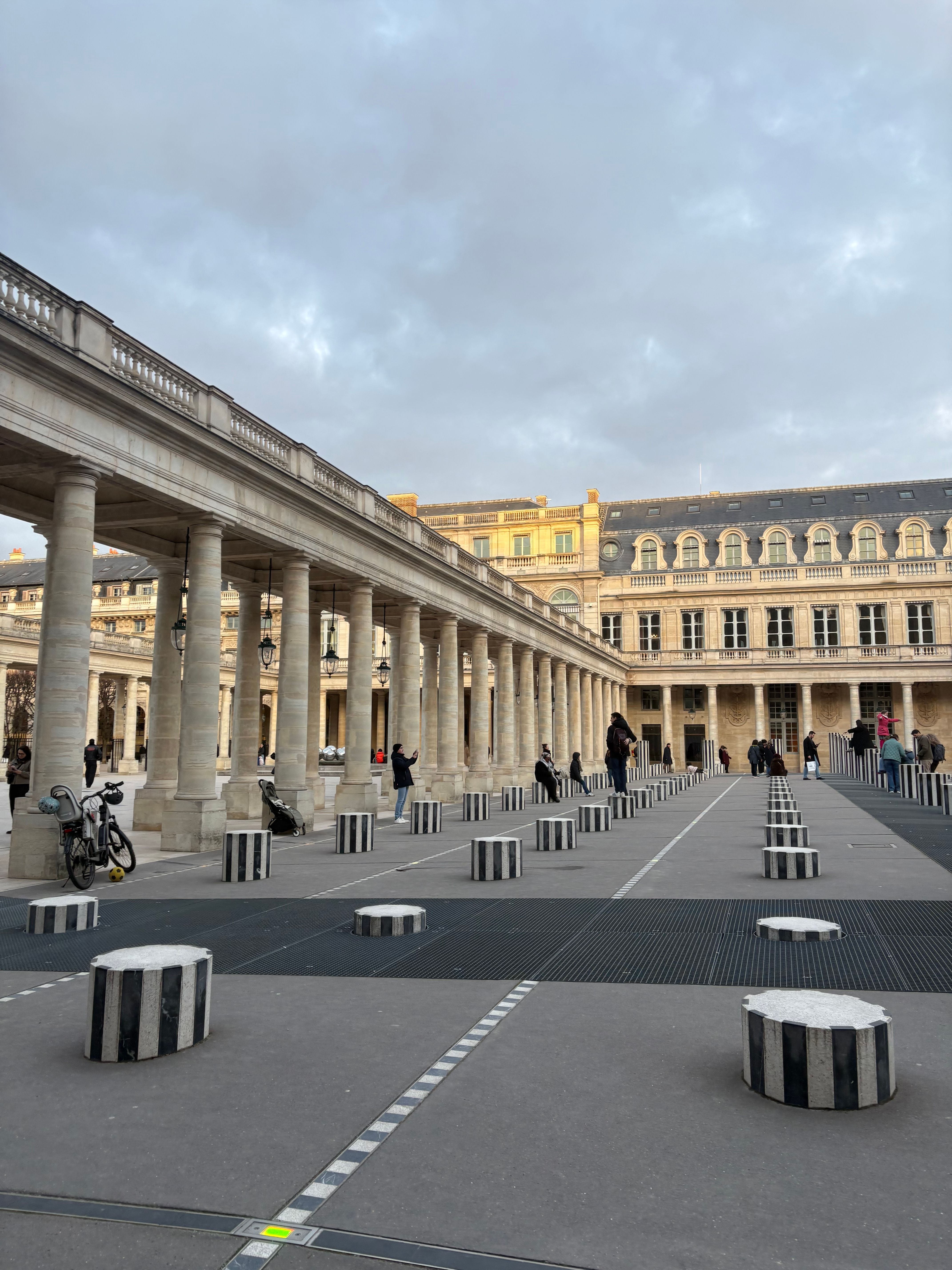 Captivating view of Les Colonnes de Buren at Palais Royal, Paris during daytime.