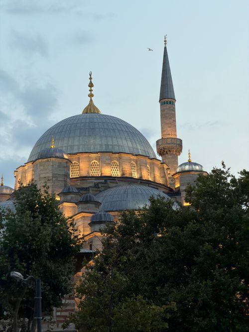 Free Beautiful illuminated mosque in Istanbul with a dramatic sky at dusk. Stock Photo