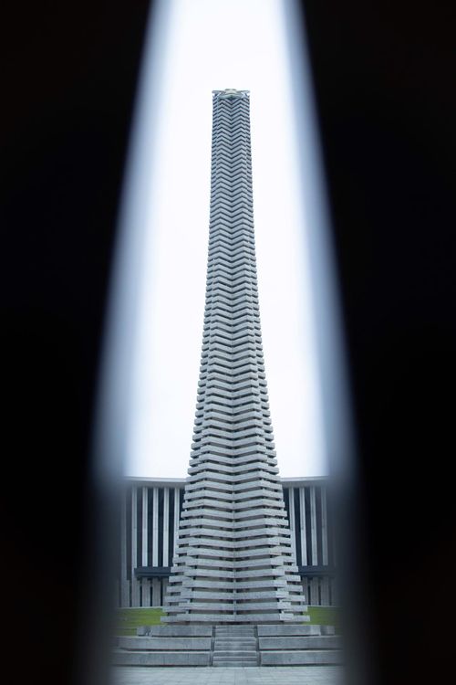 Free Unique perspective of Hanoi monument framed by dark shadows, creating a dramatic effect. Stock Photo