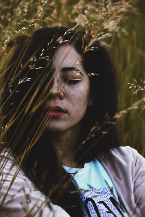 Woman Behind A Grass