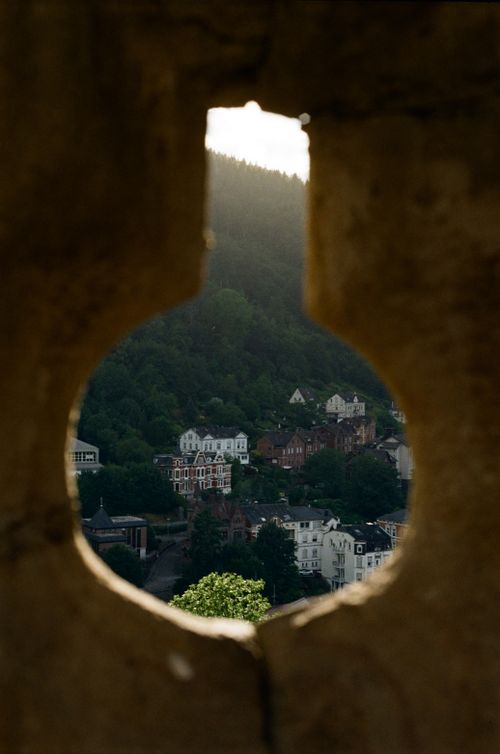 Free Picturesque view of Altena, Germany seen through a stone opening, capturing charming hillside architecture. Stock Photo