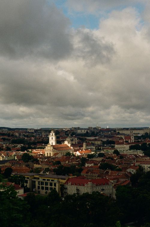Free Aerial view of Vilnius, Lithuania with historic churches under dramatic sky. Stock Photo