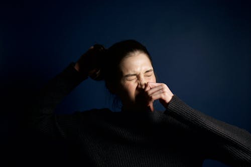 Woman Touching Her Nose