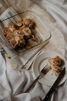 Freshly baked cinnamon rolls served on a tray, perfect for a cozy breakfast setting.