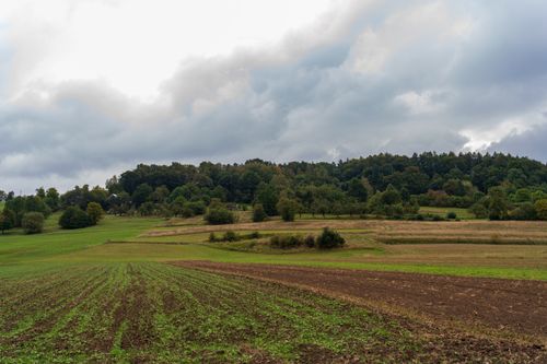 Free Scenic autumn view of a rural landscape in Małopolskie, Poland, with cloudy skies. Stock Photo