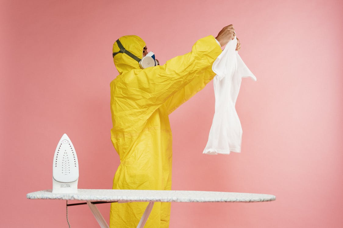 Free Person In Yellow Protective Suit Stock Photo