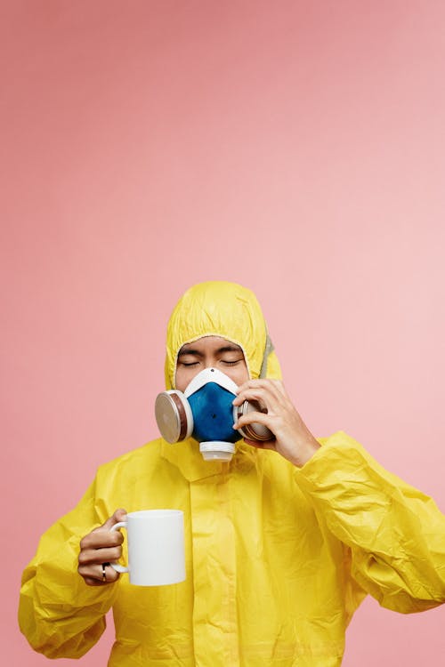 Free Person In Yellow Protective Suit Stock Photo