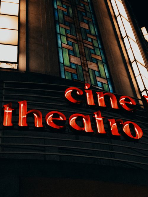 Free Art Deco style facade of Cine Theatro with neon lights in Belo Horizonte at night. Stock Photo