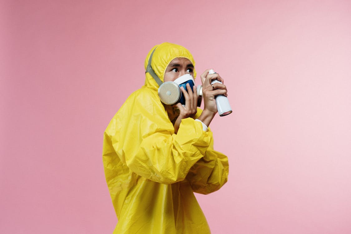 Free Person In Yellow Protective Suit Stock Photo
