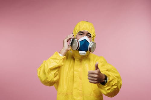Free Person in Yellow Coveralls Stock Photo