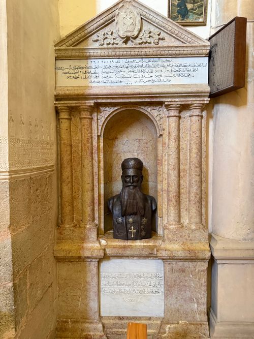 Free Intricately carved stone monument inside Lebanese church showcasing historic religious figure's bust. Stock Photo