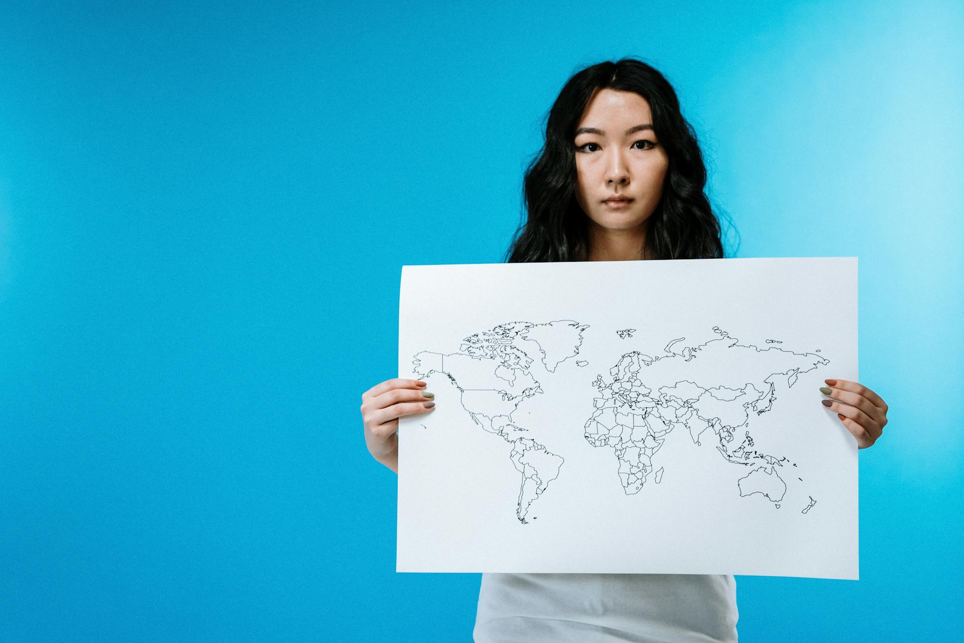 Woman Holding World Map