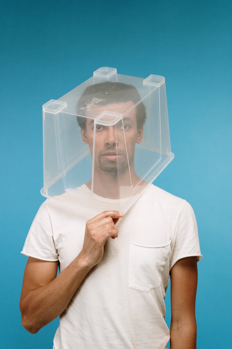 Man Wearing Plastic Box On Head