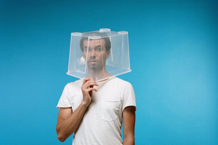 Man Wearing Plastic Box On Head