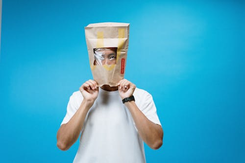 Free Man Wearing Paper Bag on Head Stock Photo