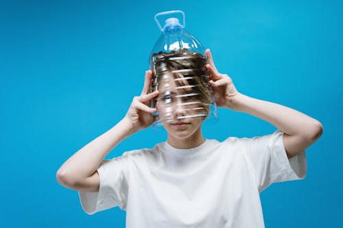 Woman Wearing Plastic Bottle on Head