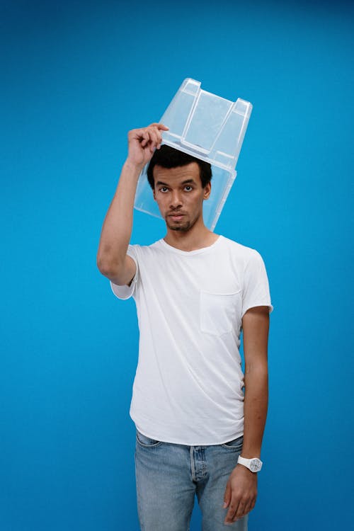 Man Wearing Plastic Box on Head