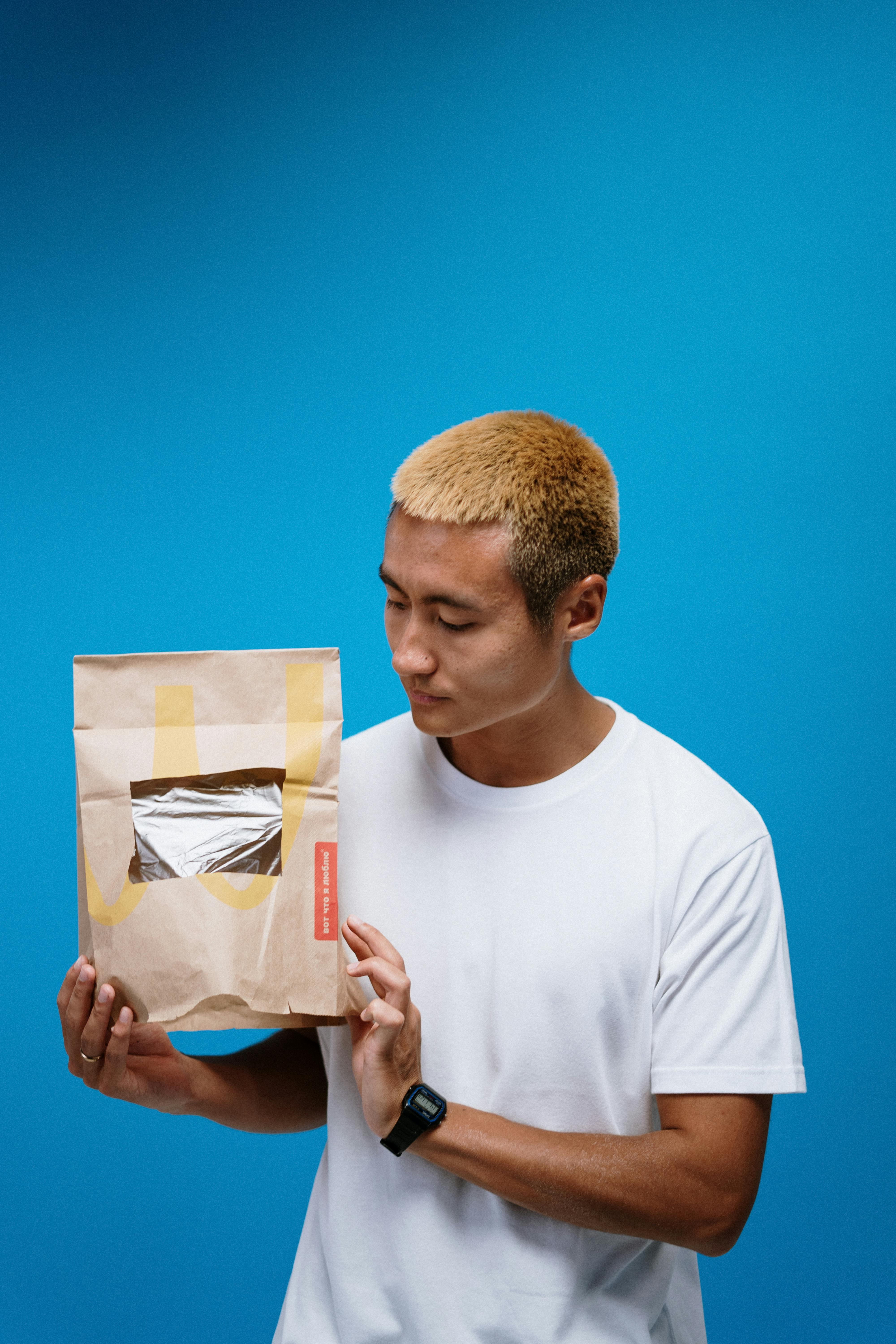 Man Holding Paper Bag · Free Stock Photo