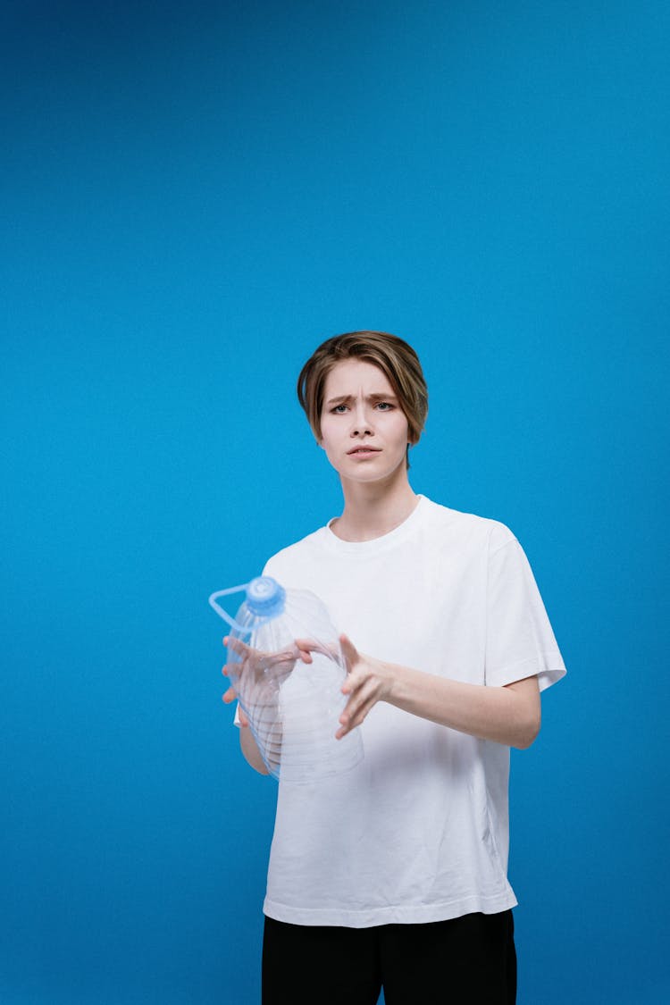 Woman Holding Plastic Bottle