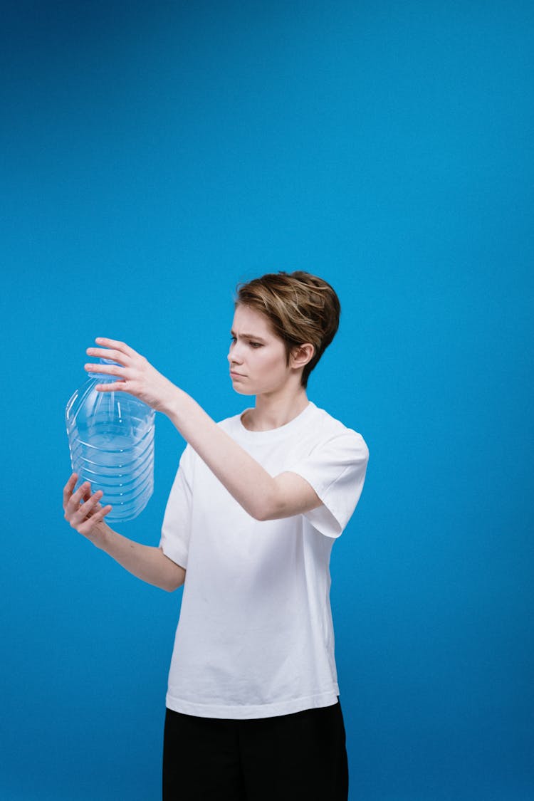 Woman Holding Plastic Bottle