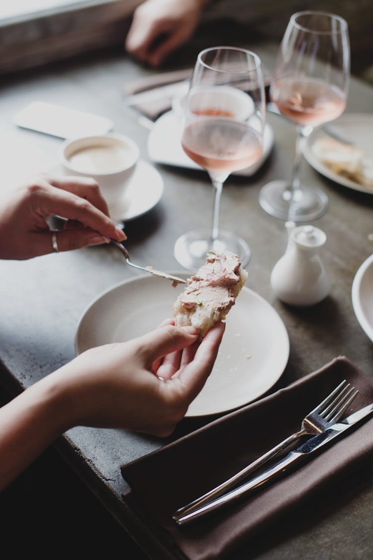 Crop Woman Spreading Pate With Knife