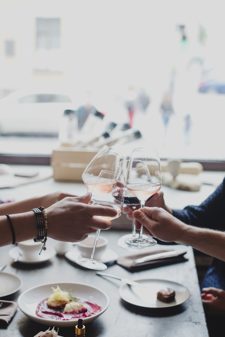 Unrecognizable Group Of Friends Clinking Wineglasses