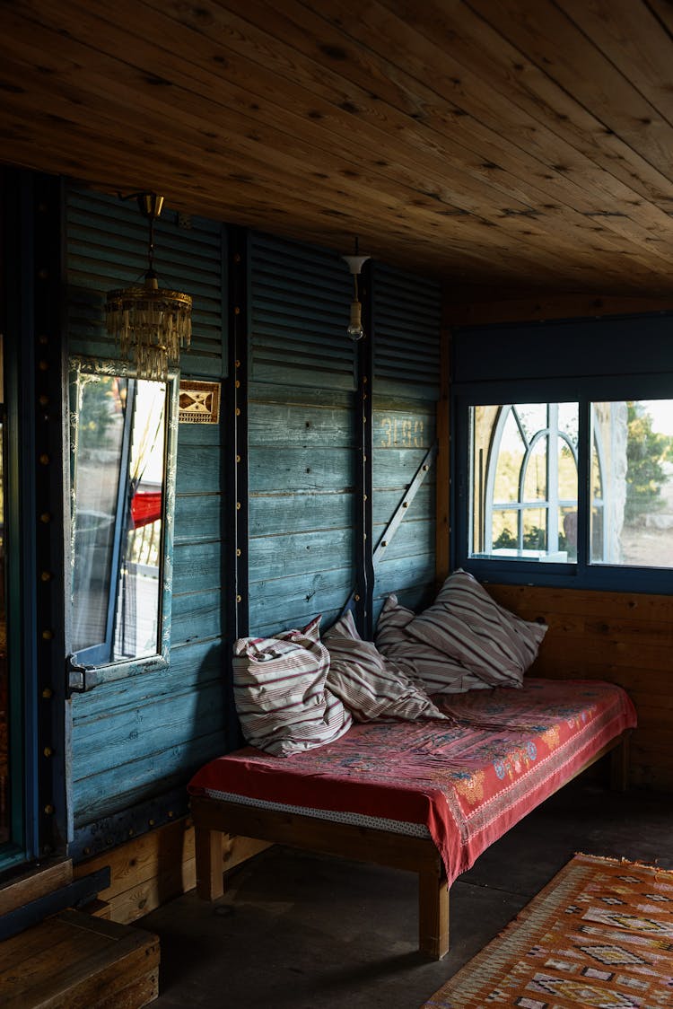 Daybed On Terrace Of Old Shabby House